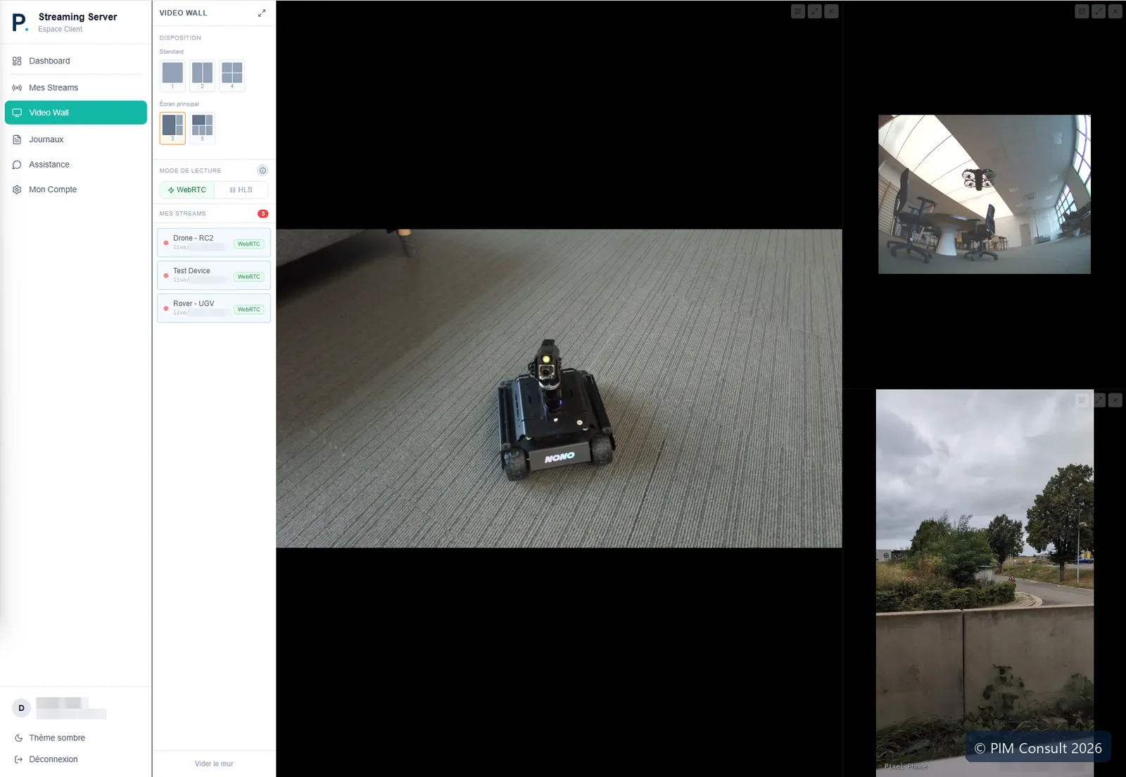 Mur vidéo : écran principal et deux vignettes, le drone en vol visible dans la vue fisheye